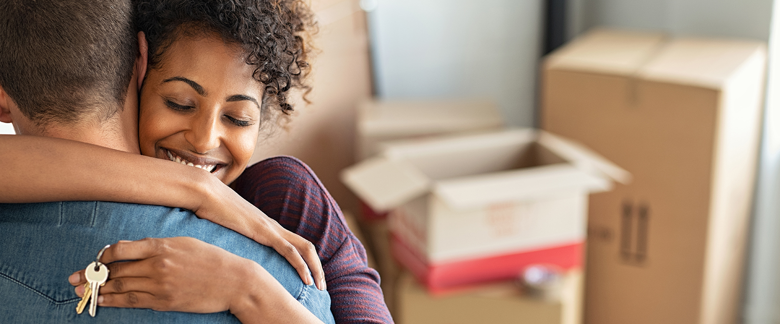 girl hugging boy with keys